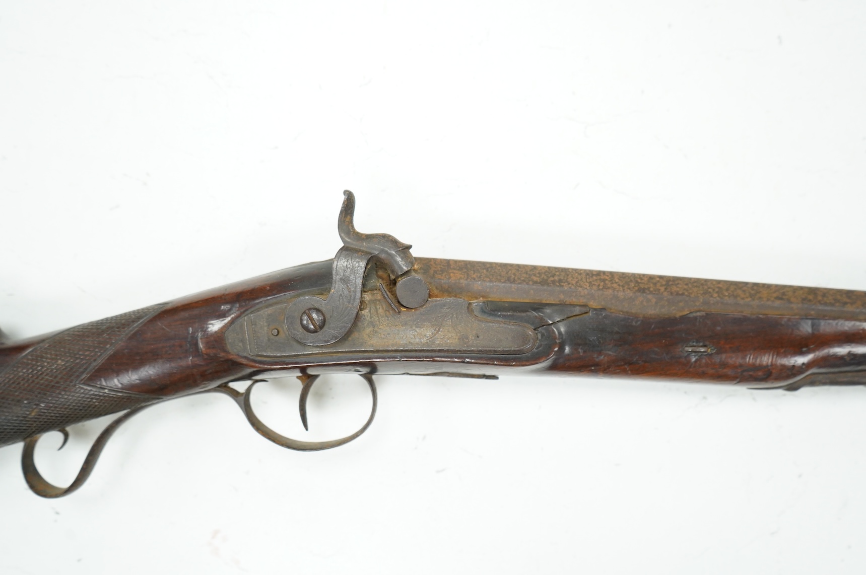 A 12 bore single barrel percussion sporting gun by J. Aston, the drum converted from flintlock, with engraved iron mounts, half stocked